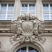 Gable over a Round Arched Window with the Corporate Logo of the former Builder, the “Austrian Credit Institute for Trade and Commerce” (Creditanstalt für Handel und Gewerbe: CAfHG) 